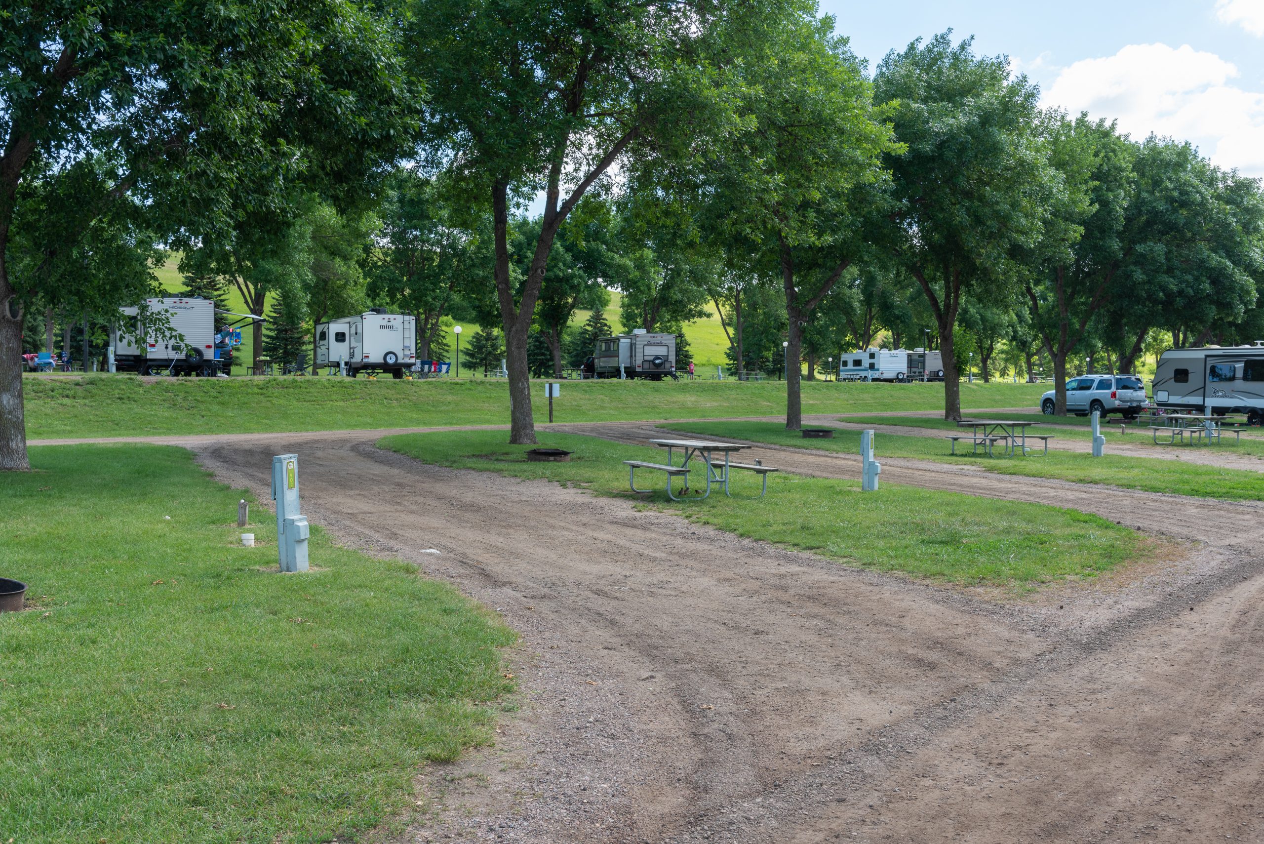 Pull through sites, 30 amp full hookup. picnic tables and fire ring on site.