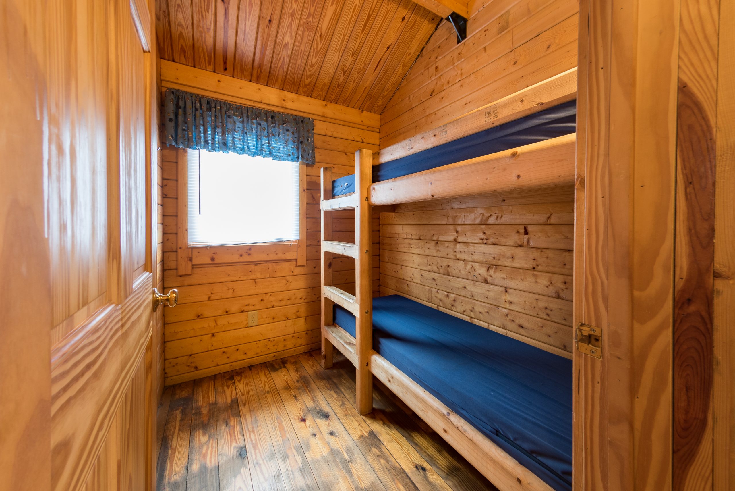 Cottage bunk room. Single bunks on right side of the room